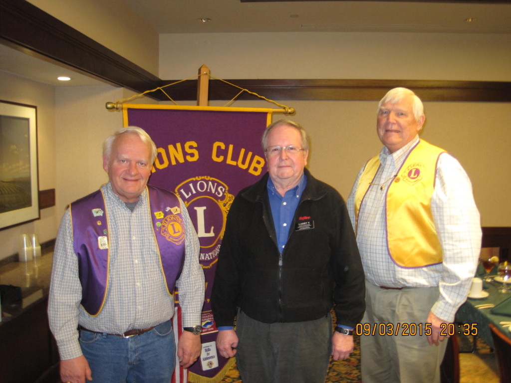 Perry Historical Preservation Commission member Larry Vodenik, center, was welcomed by Perry Lions John Andorf, left, and Gary Becker. Photo by Ray Harden, Perry Lions Secretary. 