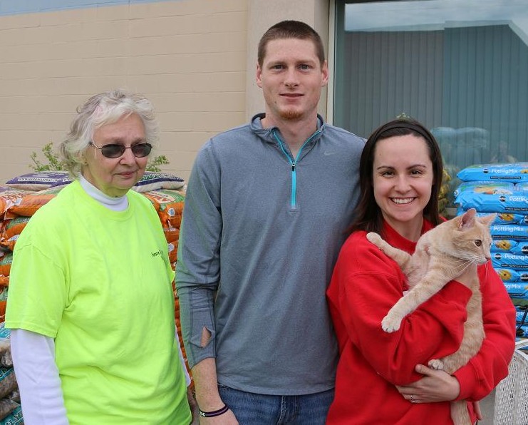 HSP volunteer Dorothea Peterson, left, pleased Zach Cole, center, and Dani Aldridge of Woodward with the adoption of Jagger in May. 