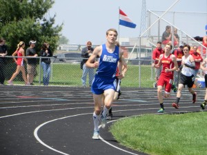 Senior Keegan Pfau en route to a conference championship in the 1600.