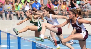 Abby Musser of W-G (green) and Hayleigh Sharp (white) of Davis County were separated by .05 seconds in the 100 hurdle preliminaries Friday and by just .04 in the 100 hurdles Saturday, with Musser nipping Sharp for second in their prelim heat and for sixth in the finals.