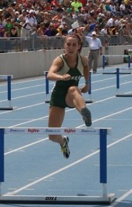 Abby Musser, on her way to third place in the 400 hurdles in a school record 1 minute, 5.44 seconds.