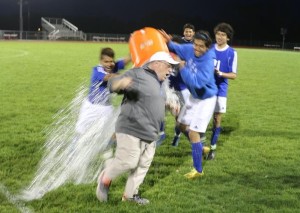 Perry head coach Gary Overla avoided most -- but not all -- of a celebratory dumping of the water cooler after the Bluejays defeated ADM, 1-0, in Adel Tuesday to all but sow up an outright Raccoon River Conference championship -- one year after the Jays were forced to share the crown with the Tigers.