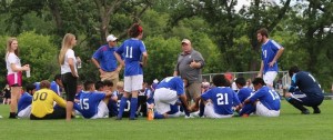The Bluejays listen to head coach Gary Overla during the intermission.