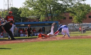 Perry pitcher Alex Long takes a flip from Zach Roberts after a wild pitch and applies the tag in time to nail Kyle Christensen at the plate.
