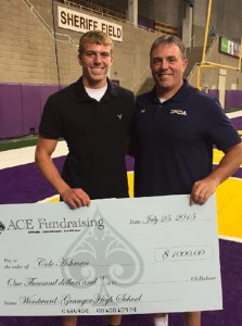 Woodward-Granger Class of '15 graduate Cole Ashman poses with his father and Hawk head coach George at the UNI-Dome Satruday, where Cole was one of five Iowans to receive a $1,000 scholarship from the IFCA and ACE Fundraising. The award was presented prior to the Iowa Shrine Bowl game.