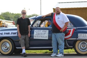 ThePerryNews.com entry in the Independence Day parade was a 1951 Oldsmobile, owned and piloted by Mike Caufield. That is Editor/Publisher Jim Caufield at left, and Sports Editor Jeff Webster on the right.