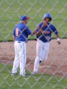 Janier Puente is congratulated by Perry skipper Mike Long after his solo home run in the fifth inning.