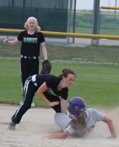 W-G's Alison Soelberg tags out WCV's LIlly Smithson, who was trying to take an extra base after hitting a RBI-single in the first inning July 6. Shortstop Miranda Aunspach looks on for the Hawks.