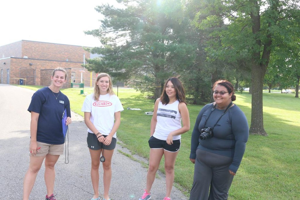 Becky Towers, left, MCB program coordinator, was assisted at race time by, from left, Perry High School student Chelsea Krueger, 16, Danery Salgado, 21, of Perry and Brenda Torres, 20, of Perry.