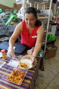 ISU Extension and Outreach Human Sciences Specialist Rosa Gonzalez served up mango tacos at the Oasis Market.