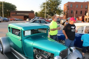Chamber organizer Dave Wright, left, handed out the prizes in the Perry Cruzze car show Friday in downtown Perry.