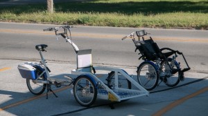Some All Ability Cycles feature a chair for a passenger to ride in, and others offer a platform to which a wheelchair can be anchored.