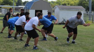 The Bluejay linemen work on their pulling skills.