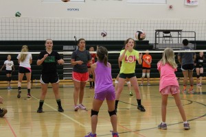 W-G head coach Meg Jackson (facing, red shorts) made sure she spent time with each camper.