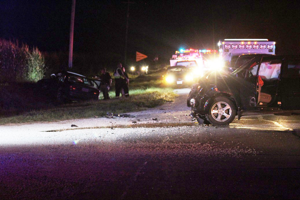 A Honda Pilot, driven by Ryan Wedemeyer, 41, of Johnston, sits in the intersection of Iowa Highway 44 and K Avenue after striking the Oldsmobile Intrigue (at left) driven by Timothy Andrews, 15, of Adel. Andrews had failed to yield upon entering the highway and was tranported to Mercy Hospital in Des Moines by Lifeflight.