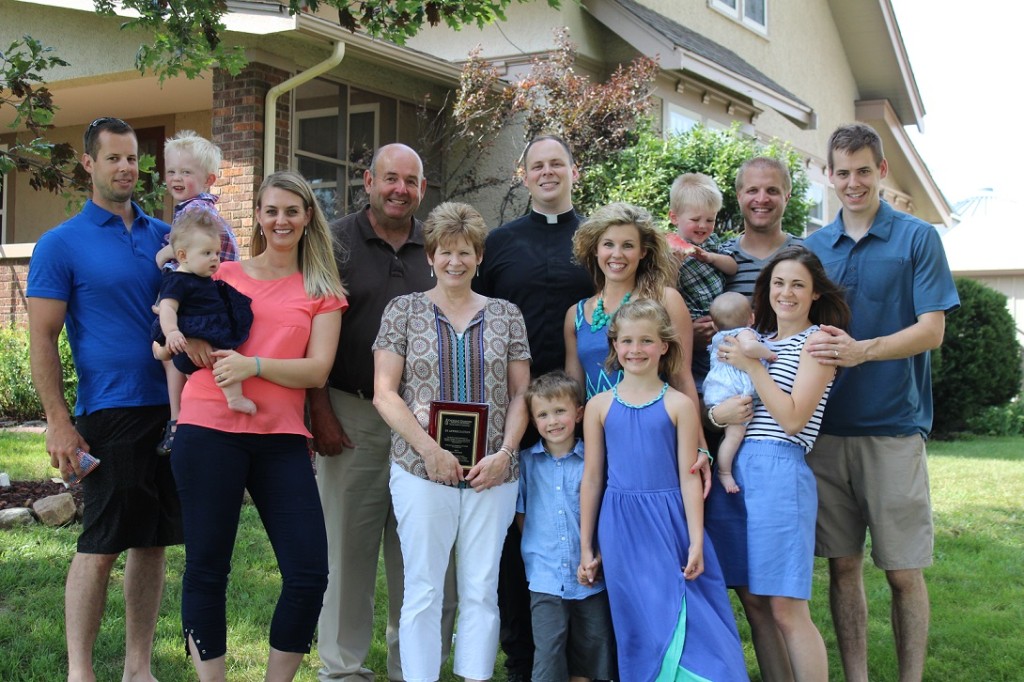 The Kautzky family: Brian (holding Joseph) and Bridget (with Clare), Greg and Lori, Father Zach, Ashley and Nathan Platt (holding Shepherd, holding watermelon), Aaron and Alex (with Bernadette). Walker and Delaney Platt are in front. Jenny (Kautzky) Bulmanski of San Diego was not present, as her husband, Brady, is currently deployed overseas with the U.S. Navy.