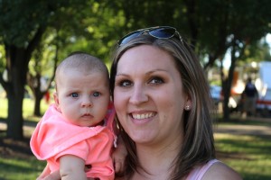 Amy Sonntag of Grimes and 3-month-old Kendall enjoyed the warm weather Saturday in the Granger Days' Vendor Village. Sonntag sells ladies' wear under the name Lularoe Amy Sonntag.