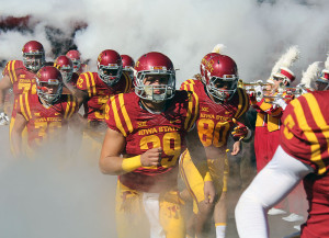 Iowa State starting linebacker Kane Seeley (29) charges through the dry ice fog with his teammates minutes before the start of their rivalry game with Iowa at Jack Trice Stadium in Ames Sept. 12. Seeley's senior season starts Sept. 3 when ISU hosts Northern Iowa.
