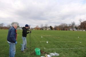 Environmental scientists Brian Lenz of Des Moines, left, a state-certified groundwater specialist, and Andrew Gustin of Waterloo, a field technician, collected soil and ground water samples Nov. 10 on the grounds of the former junior high school. Construction is expected soon to begin at the site of the planned Newbury Living senior housing units.