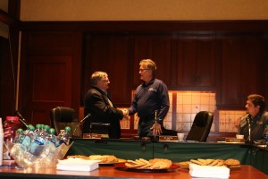 With cookies for the post-meeting reception waiting, retiring Perry City Council member Phil Stone, left, was thanked by Perry Mayor Jay Pattee and the rest of the assembled councilors at Monday night's meeting.