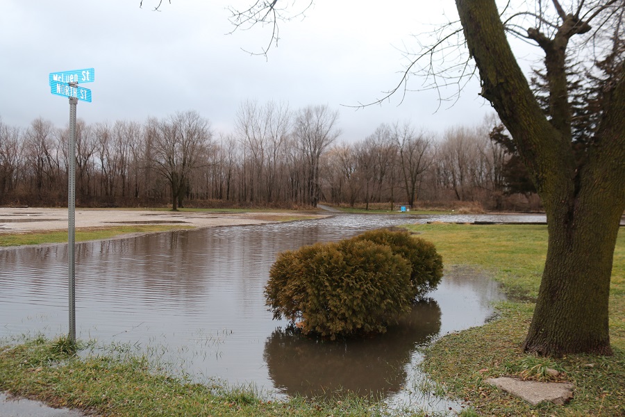 Perkins Park in Perry and the intersection of North and McLuen streets are saturated with the weekend's rains.