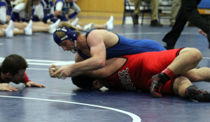 Eli Saemisch controls his opponent en route to a pin in Perry's win over Roland-Story Thursday.