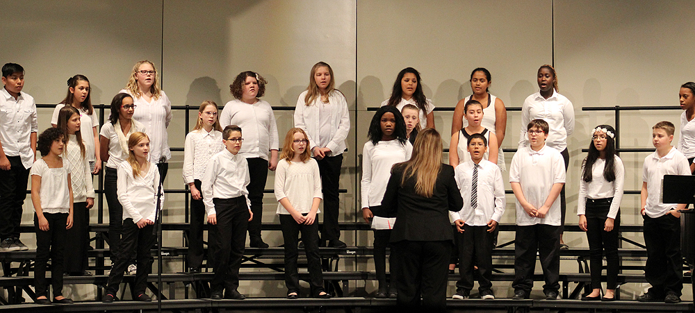 The Perry Sixth Grade Choir sang "A Winter Carol" and "Sleigh Ride."