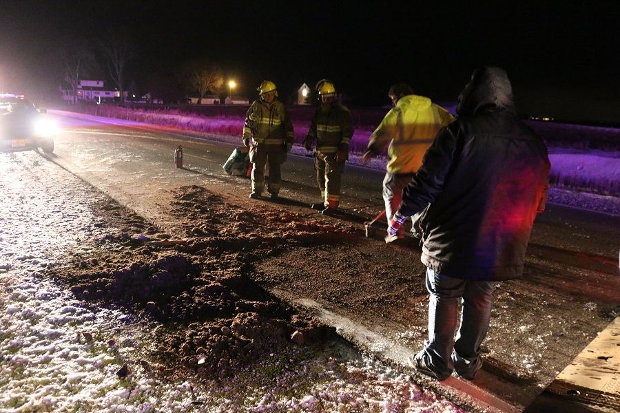 Emergency responders mopped up after a car rear ended a slow-moving tractor about 6 p.m. Saturday on County Road R22 east of Dallas Center. 