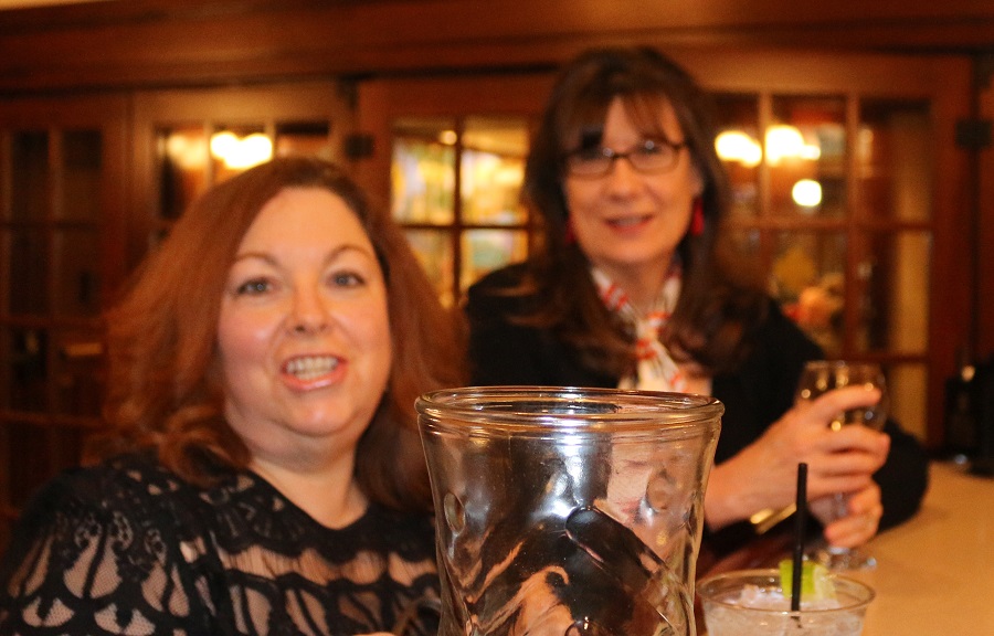 Kelli Weber of Woodward, left, and her longtime school chum Elaine Mattingly of Newton reunited Friday at the Hotel Pattee in Perry during a performance of the J. J. Express.