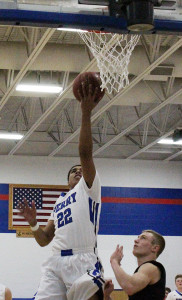 Perry senior guard Shammond Ivory lays in two of his 15 points against Roland-Story Saturday.