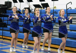 Perry cheerleaders, from left, Brooke Huntington, Sidney Vancil, Emma King, Maddy Jans and Mariah McNamara pump up the student section during Tuesday's games against Ballard.