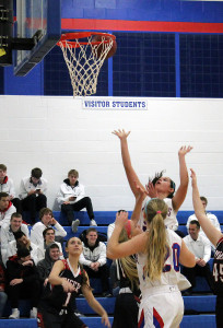 Taylor Lathrum scores for Perry as Alyssa Kruger (20) awaits a possible rebound.