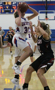 Grace Marburger shoots over Brianna Mueller during Perry's RRC game with visiting ADM Tuesday.