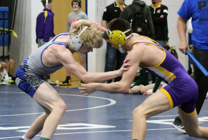 Perry's Zach Thompson and Webster City's Drake Doolittle tangle for the title at 113 pounds Saturday in the Perry Invitational.