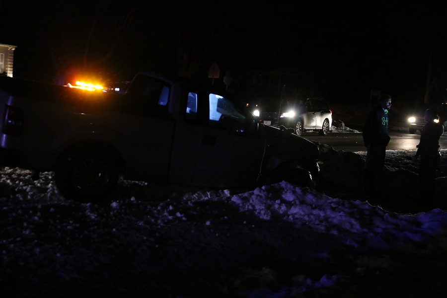 A Perry Police Department officer administers a field sobriety test to the driver of a pickup truck that struck a power pole on Willis Avenue Saturday night. There were no apparent injuries.