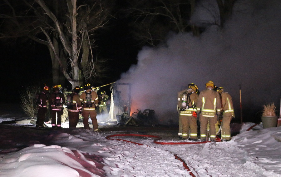 The garage owned by Ryan and Elicia Brancheau of rural Redfield was destroyed, but firefighters checked the blaze from spreading to the Brancheau home.