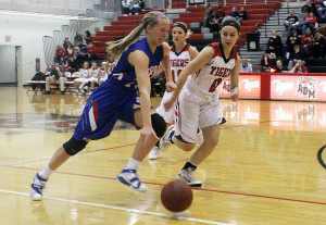 Perry's Emma Olejniczak races ADM's Isabel LaFollette down the court during their RRC meeting Feb. 2.