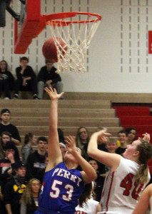 Taylor Lathrum scores for Perry against host Boone Saturday in their Class 4A Region 7 First Round game. The senior led the Jayettes with 14 points.
