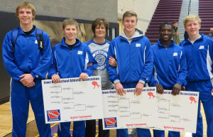 Perry Community School District Superintendent Lynn Ubben poses in Webster City Saturday with the five Bluejays who will be wrestling in the state tournament. From left are, Eli Saemisch (170 pounds), Kaleb Olejniczak (106), Ubben, Kade VanKirk (132), Gisaveri Niyibizi (126) and Zach Thompson (120). Photo submitted.