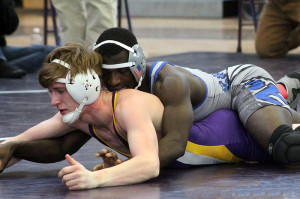 Perry's Gisaveri Niyibizi controls Webster City's Cole Nokes en route to a 2-1 win in the district finals at 126 pounds Saturday.