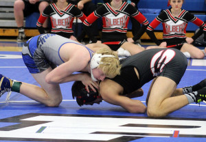 Zach Thompson of Perry battles for an advantage against Gilbert's Sinjin Briggs in the sectional finals at 120 pounds Saturday. Thompson recorded a pin in 4 minutes and 39 seconds.
