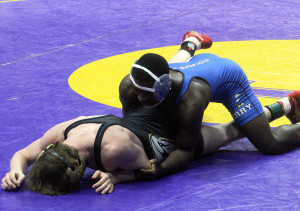 Perry's Gisaveri Niyibizi advnaced to the semifinals at 126 pounds in the Class 2A state tournament with a 5-3 win over Glenwood's Trevor Anderson. Niyibizi scored this take down with eight seconds remaining to seal the win.