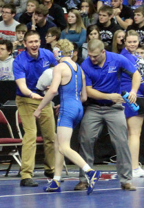 Perry sophomore Zach Thompson is congratulated by assistant coach J.P. Hulgan (left) and head coach Trevor Kittleson after ensuring a spot on the podium with a quarterfinal win at the Class 2A state tourney this season. Kittleson resigned recently to become the assistant coach at Loras College.