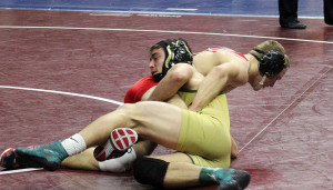 Woodward-Granger's Race Brant battles fourth-rated Blake Lawless of Albia in the first round of the Class 2A 152-pound bracket at the state wrestling tourney Thursday.