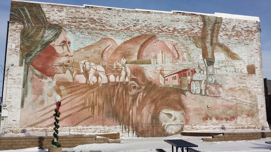 Dinnis Adams painted the Centennial Mural in 1983.