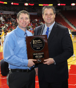 Perry boys basketball head coach Ned Menke (left) accepts the Iowa Banker's Association's Student Athlete Achievement Scholarship Award for Class 3A on behalf of Bluejay senior Alex Long at the state tourney last week. Presenting the award was Terry Nielsen, President and CEO of Raccoon Valley Bank in Perry.