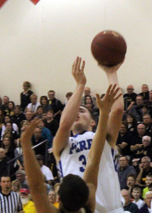 Perry forward Kyle Nevitt scores off the glass in overtime against Glenwood in Monday's Substate 8 Final in Atlantic.
