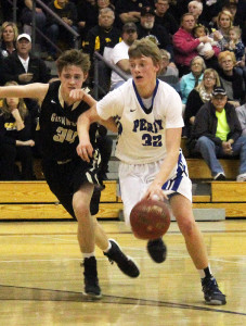Perry's Ryan Rathje puts the ball on the floor and blows by Glenwood's Christian Stanislav Monday in Atlantic during the Substate 8 Final.