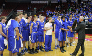 The Perry players receive a State Participation plaque and medals after their quarterfinal loss Mar. 8.