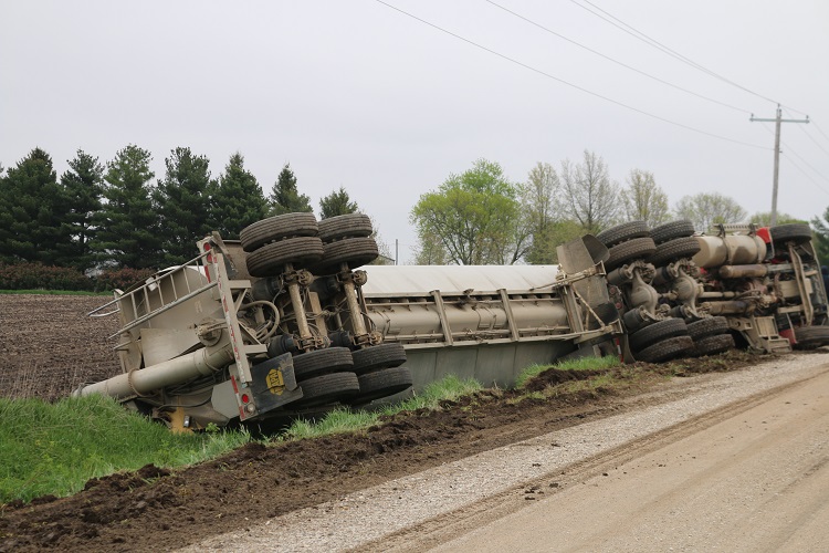 Saturated shoulders appeared to be a factor in the roll over of a semi-tractor trailer on 220th Street near D Avenue Friday morning.